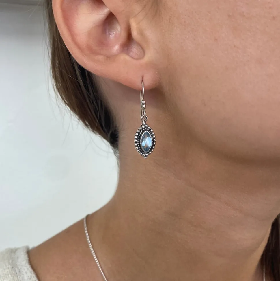 solid_silver_blue_topaz_o_2.webp Solid Silver Blue Topaz Ornate Drop Earrings