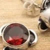 Solid Silver Garnet Stud Earrings with Triple Curve Frame