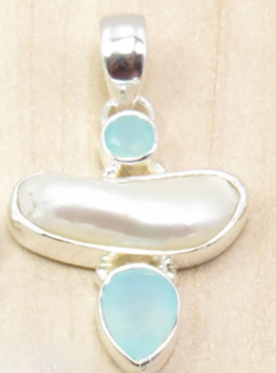 solid_silver_handmade_biw_0.webp Solid Silver Handmade Biwa Pearl Pendants
