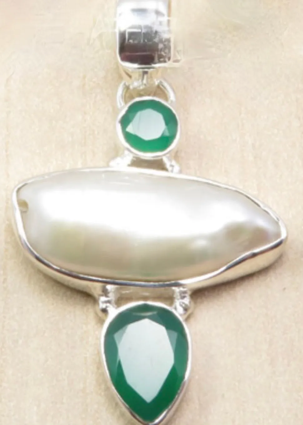 solid_silver_handmade_biw_1.webp Solid Silver Handmade Biwa Pearl Pendants