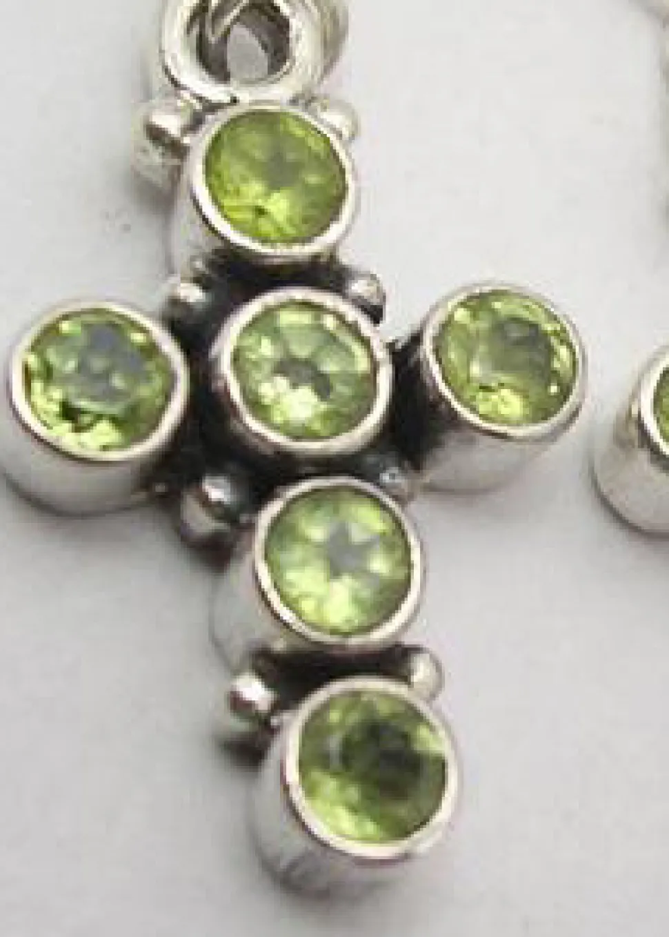 solid_silver_peridot_encr_1.webp Solid Silver Peridot Encrusted Cross Drop Earrings