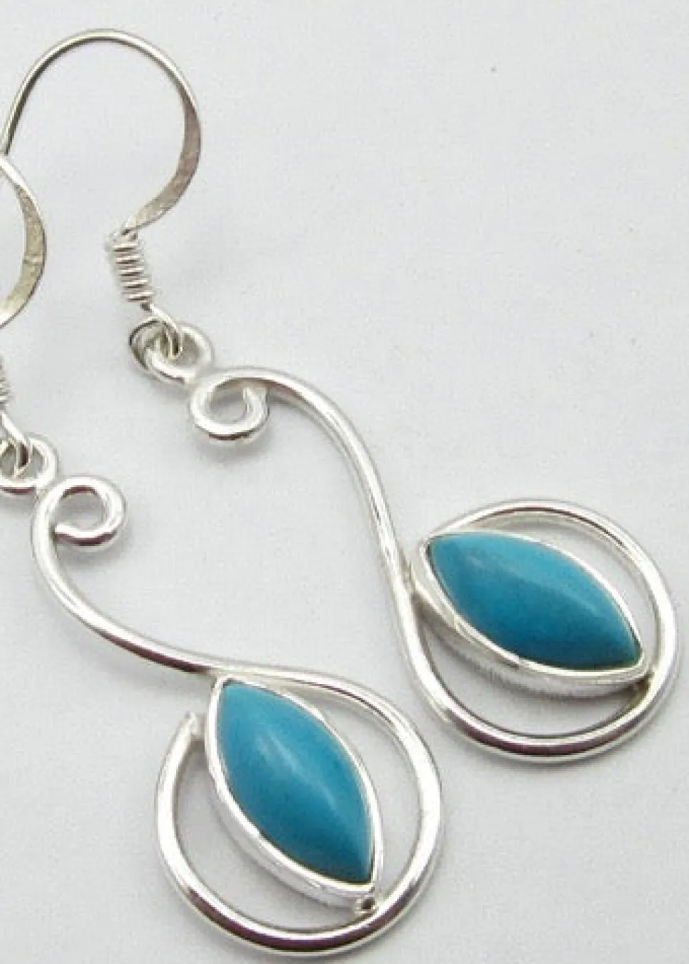 solid_silver_turquoise_sc_0.webp Solid Silver Turquoise Scroll Drop Earrings